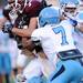 Skyline puts a stop to Dexter senior Alex Mortensen during the first half at Dexter on Friday night.